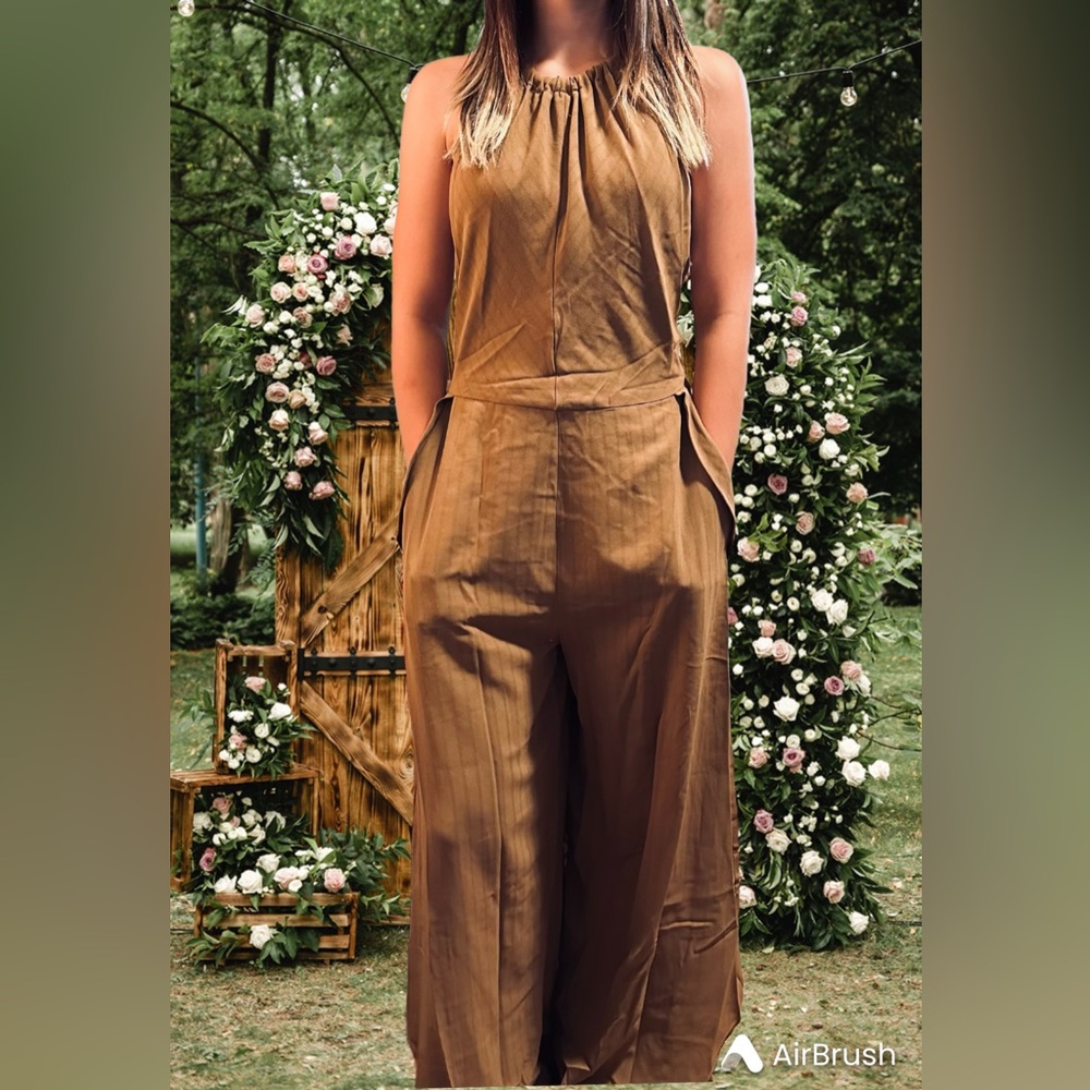Women’s Summer Halter-Neck, backless, wide leg jumpsuit with pockets.